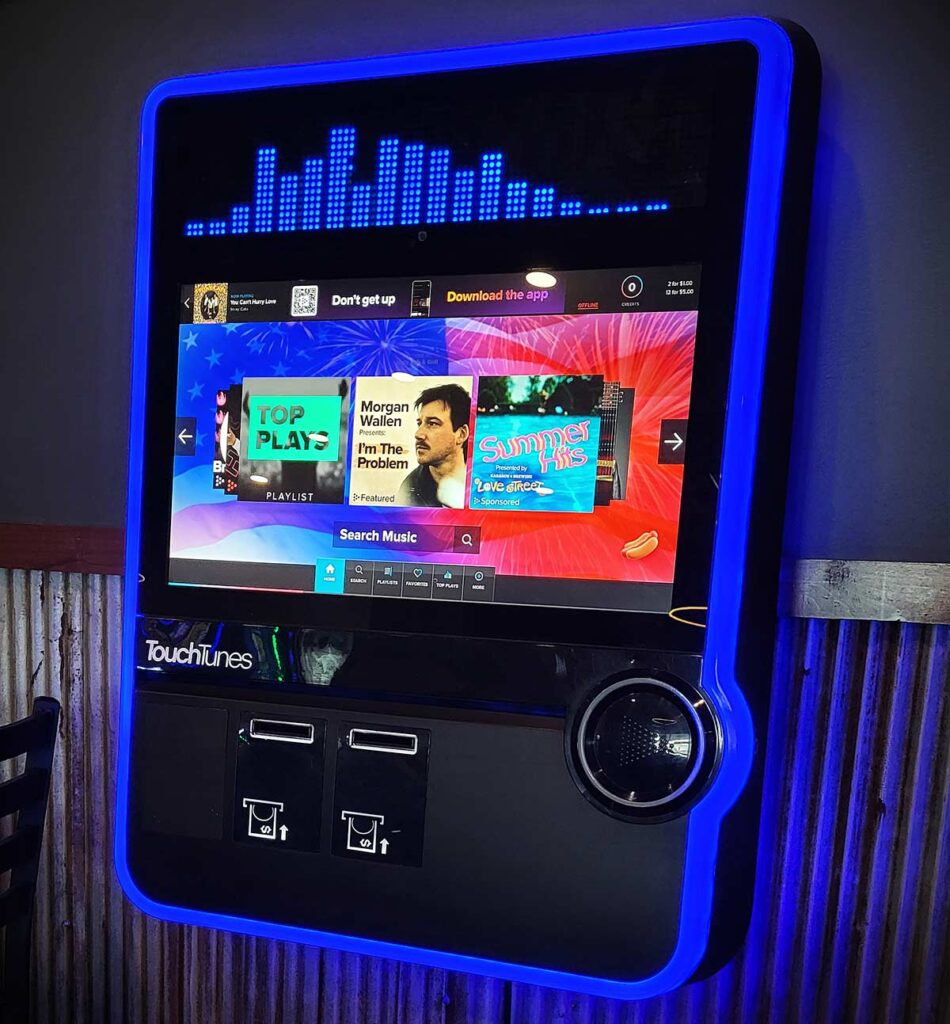 TouchTunes digital jukebox on the wall of a wisconsin tavern.