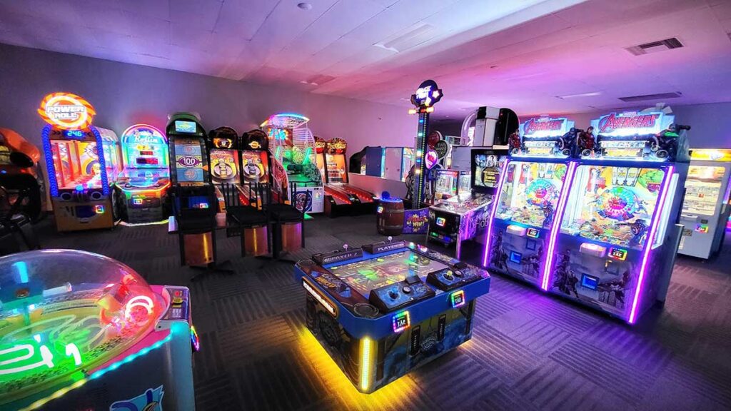 A variety of coin-operated games in an arcade.